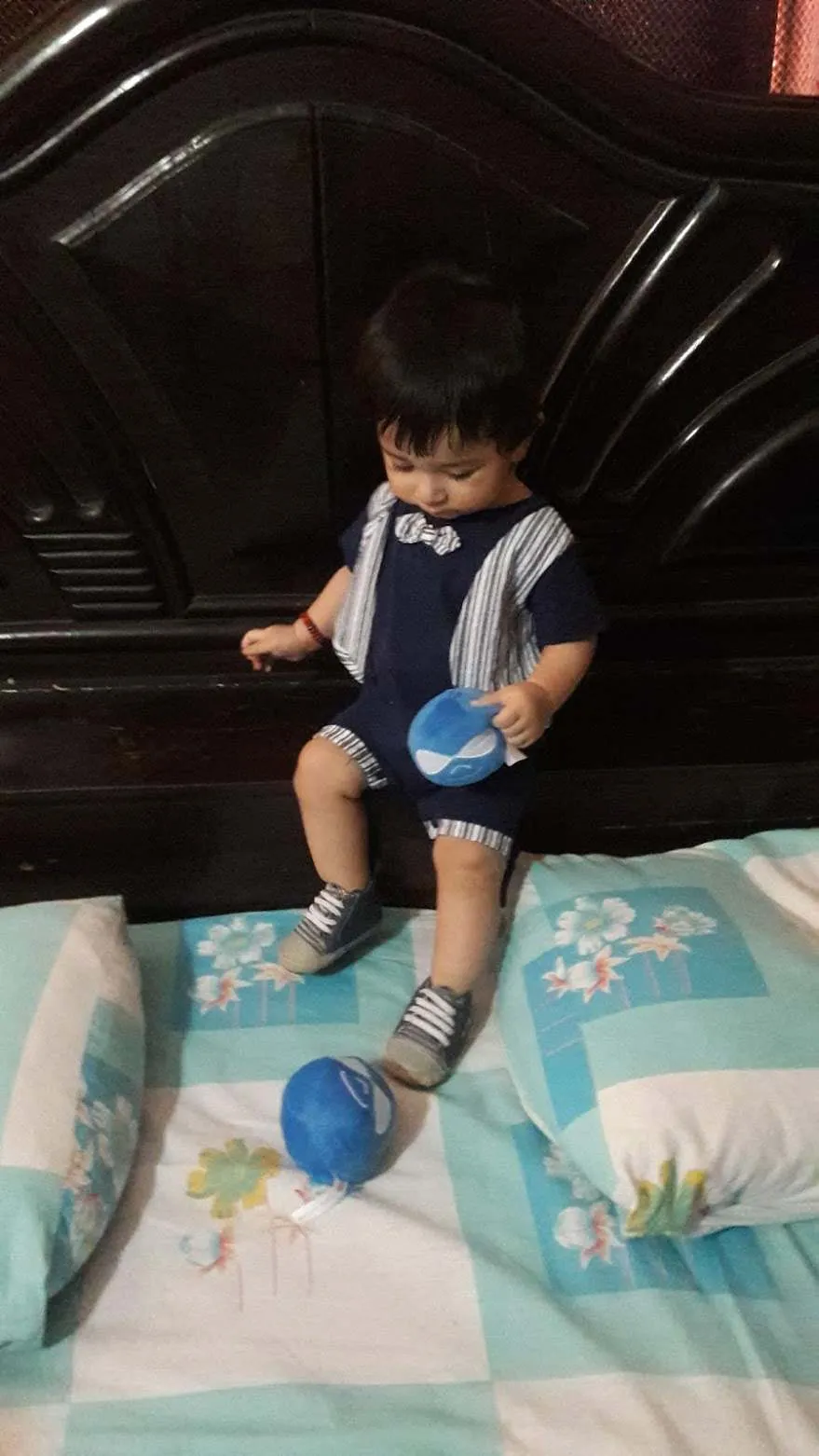 My baby playing with the logos his father loves